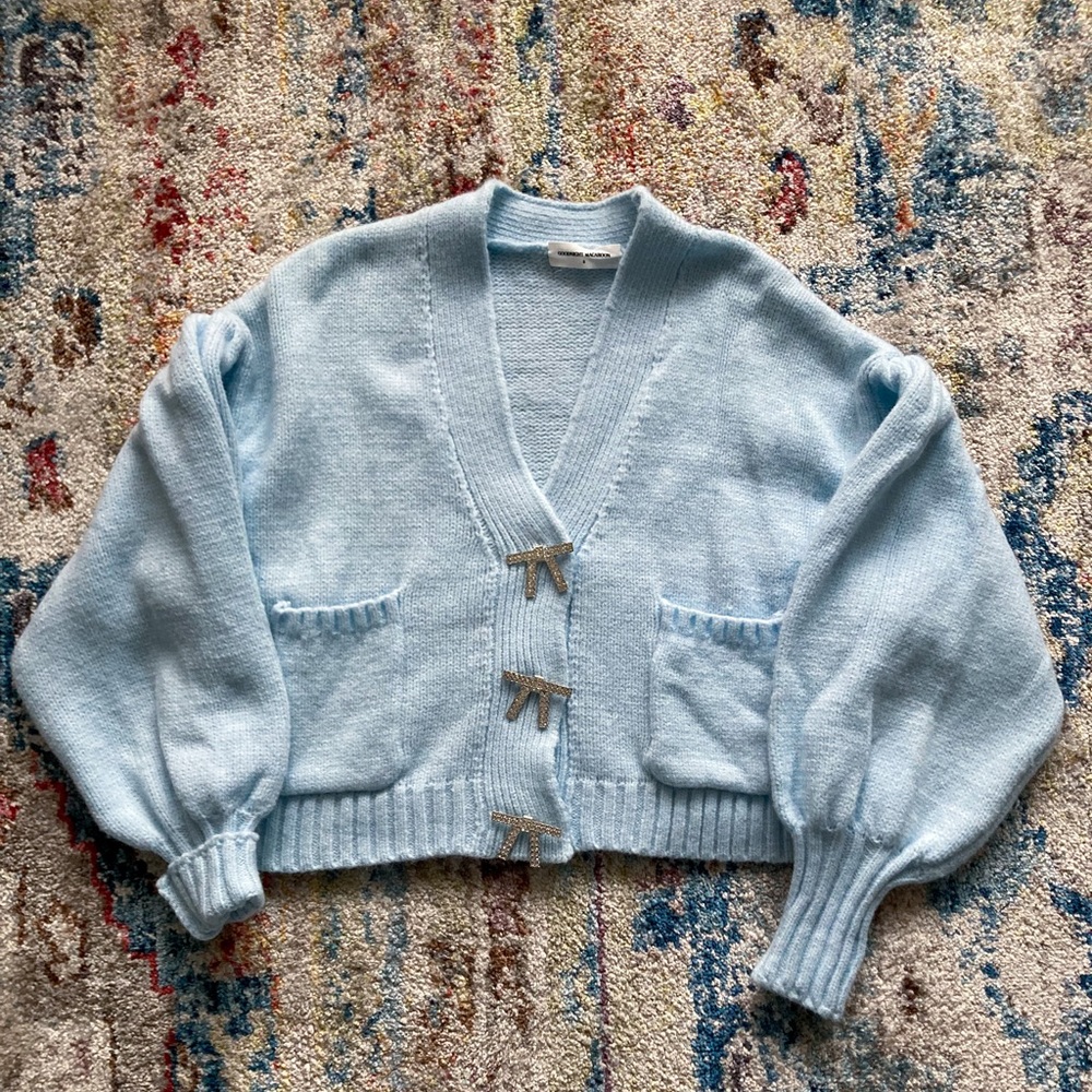 Blue puff sleeve sweater with bow buttons